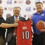 UBC and Raptors staff hold up jersey to announce training camp